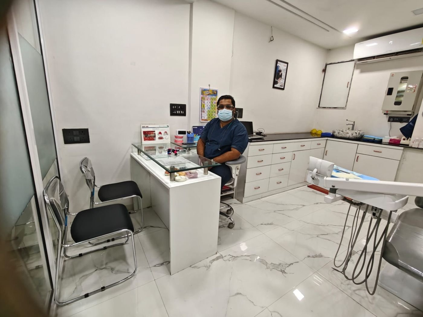 Dr. Gotise at the consultation desk
